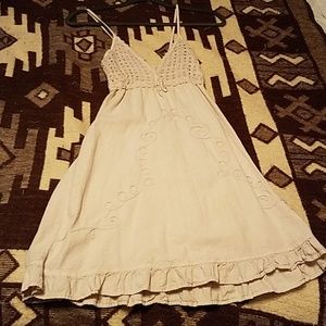 A cream colored sun dress